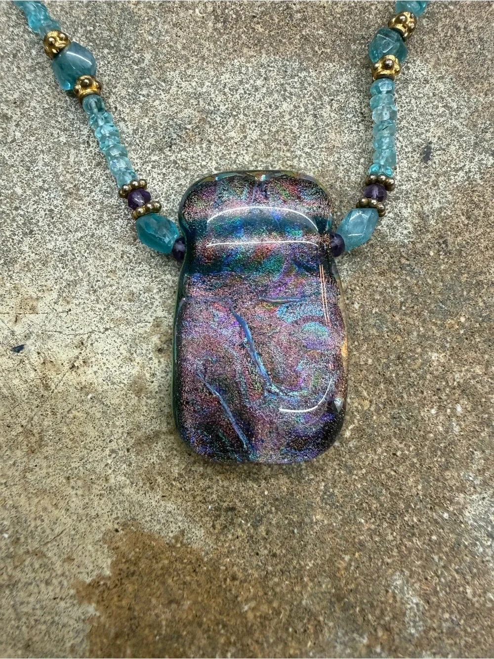 Handcrafted Teal Beaded Necklace with Iridescent Purple Pendant